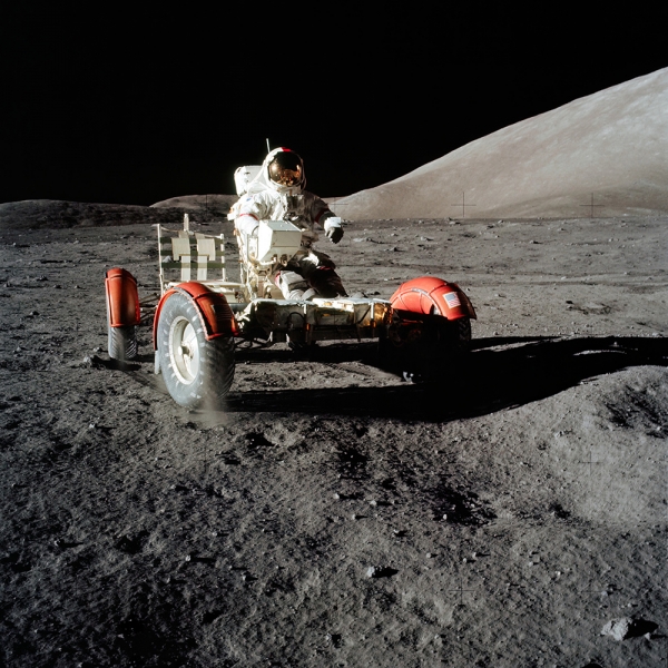Astronaut Eugene A. Cernan, commander of Apollo 17, drives the Lunar Roving Vehicle 